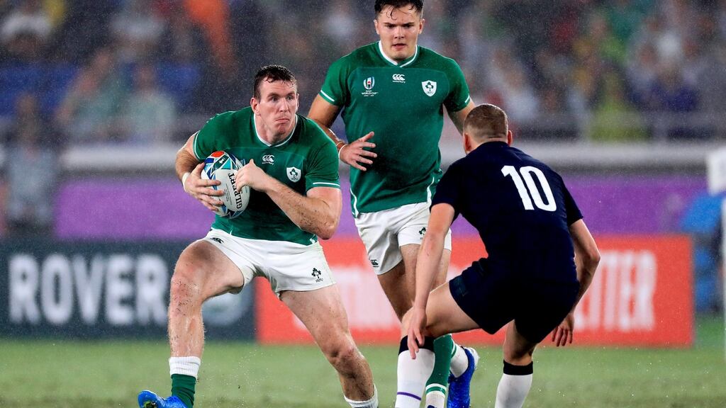 Chris Farrell of Ireland takes on Finn Russell of Scotland in Yokohama on Sunday. The fears and worries of Ireland’s scalding defeat in Twickenham in late August were definitively put to bed. Photograph: ©INPHO/Craig Mercer