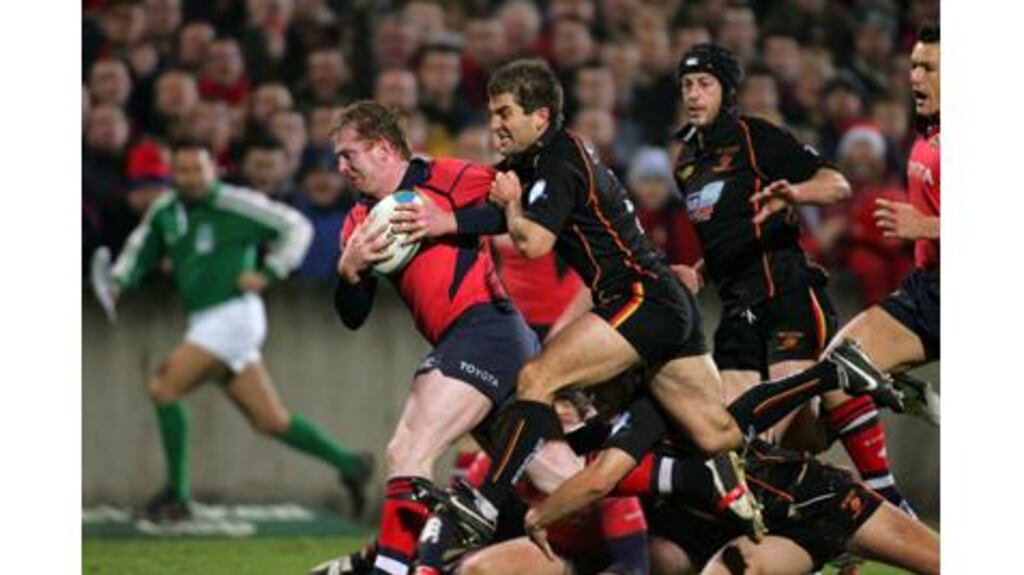Winger Anthony Horgan is tackled by scrumhalf Gareth Barber of Newport gwent Dragons during Munster's European Cup Pool One victory at Thomand Park on Saturday. Photograph: Kieran Clancy / Sportsfile.