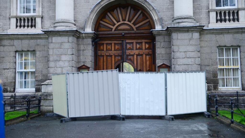The front gate of Trinity College Dublin is sectioned off in April last year after it was damaged. Photograph: Bryan O’Brien