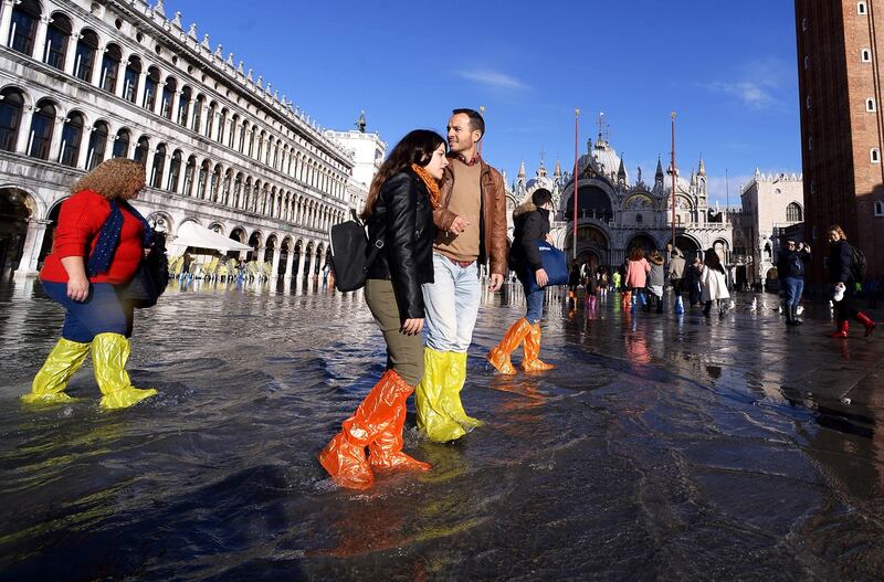 As residents assessed the implications of the floods, tourists were enjoying the novelty. Photograph: Filippo Monteforte/AFP via Getty