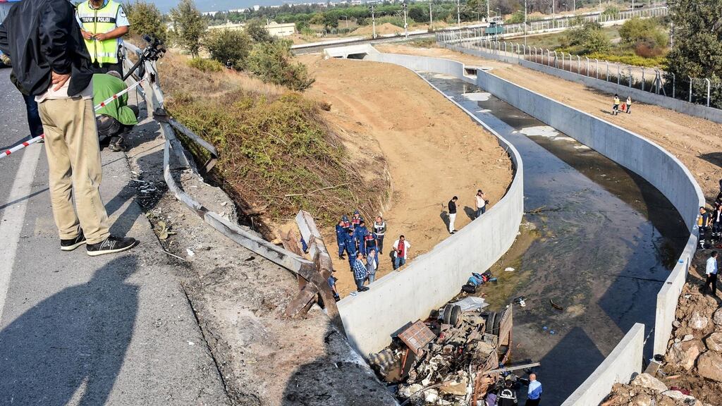 Turkish police  examine the wreckage of a truck, carrying migrants, after it crashed in Izmir, on Sunday. Photograph: Getty