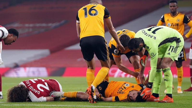 Raul Jimenez and David Luiz lay injured after clashing heads during the Premier League game at the Emirates Stadium last November. Photograph:  John Walton/AFP via Getty Images