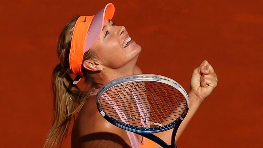 Maria Sharapova of Russia celebrates victory during her women’s singles semi-final match against Eugenie Bouchard of Canada at Roland Garros. Photograph: Clive Brunskill/Getty Images