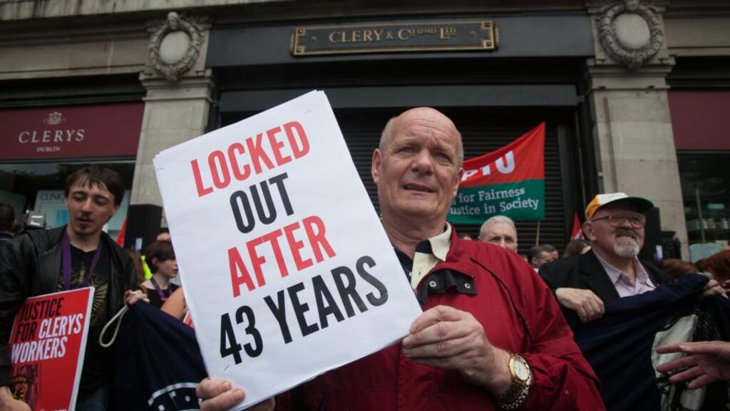 ‘In recent years vulture speculators have been easily able to wipe out what a rebellion against British imperialism could not.’ Above,  John Crowe from Artane at  a protest outside Clerys on O’Connell Street, Dublin in support of workers who lost their jobs. Photograph: Gareth Chaney Collins