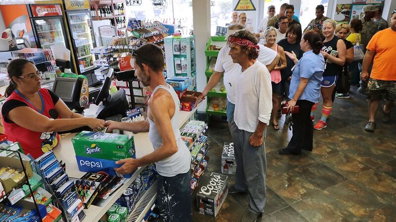 Residents and relief workers line up to buy food and supplies in Tavernier, Florida. Photograph: Chip Somodevilla/Getty Images