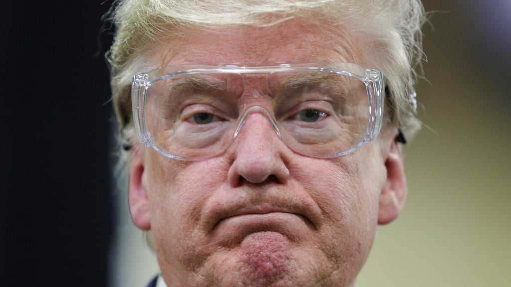 US president Donald Trump watches workers on the assembly line manufacturing protective masks for the Covid-19 outbreak  in Phoenix, Arizona. Photograph: Reuters/Tom Brenner