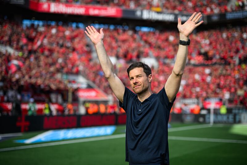 Xabi Alonso bids auf wiedersehen to Bayer Leverkusen fans after their match against Borussia Dortmund on Sunday. Photograph: Jörg Schüler/Bayer 04 Leverkusen via Getty Images