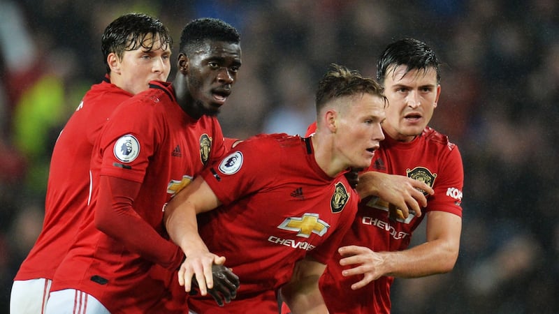 Manchester United’s Scott McTominay (second fro the right) celebrates with team-mates  after scoring during the  Premier League  match against Arsenal at Old Trafford. Photograph:  Peter Powell/EPA