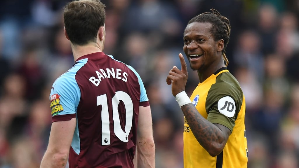 Brighton’s Gaetan Bong gestures towards Burnley’s Ashley Barnes during the Premier League match at Turf Moor, Burnley. Photograph: Anthony Devlin/PA