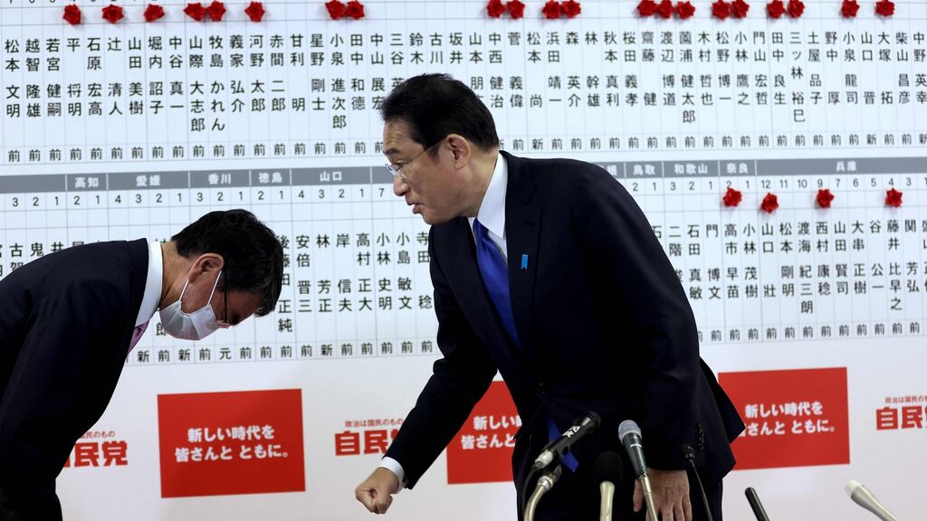 Japan’s former foreign minister and senior member of the Liberal Democratic Party Taro Kono bows to prime minister and party leader Fumio Kishida at the party headquarters in Tokyo after the general election. Photograph: Behrouz Mehri