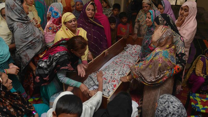 Pakistani relatives mourn over the body of a victim during a funeral following an overnight suicide bombing in Lahore. Photograph: Arif Ali/AFP/Getty Images