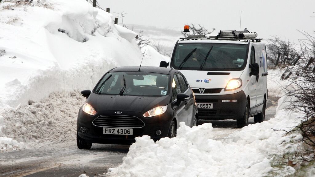 Motorists make their way through snow covered roads,on the Carnlough to Ballymena road in Co Antrim after sbnow ploughs cleared drifting snow. Photograph: Paul Faith/PA Wire