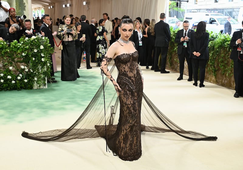 YouTuber Emma Chamberlain wore a mocha-tinged lace custom dress by Jean Paul Gaultier. Photograph: Gilbert Flores/Variety via Getty Images