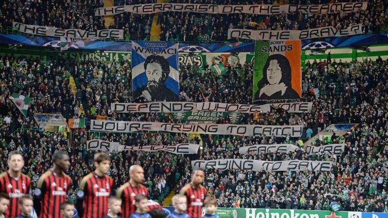Celtic supporters wave a banner featuring Bobby Sands before the Uefa Champions League game against AC Milan at Celtic Park. Photograph: Jeff J Mitchell/Getty Images