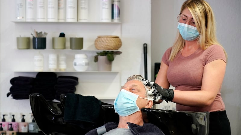 Washing hair ahead of a haircut is now compulsory in Germany. Photograph: Ronald Wittek/EPA