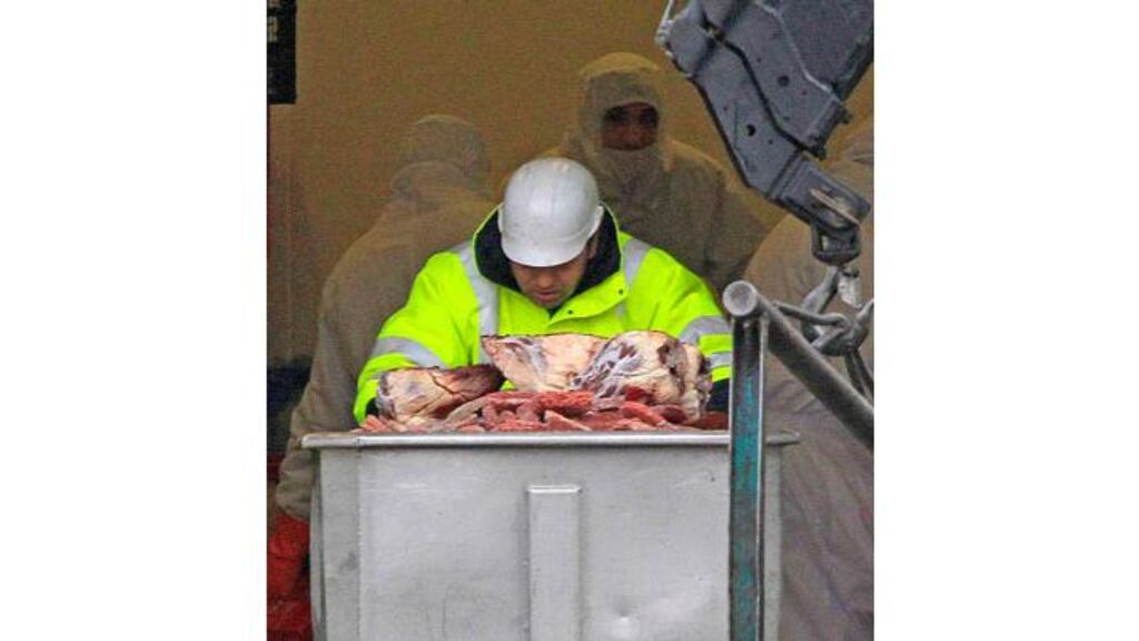 A worker pushes a container with blocks of meat before filling up a dump truck at French meat processor Spanghero's factory in Castelnaudary near Toulouse, southwestern France, last week. Photograph: Jean-Philippe Arles/Reuters