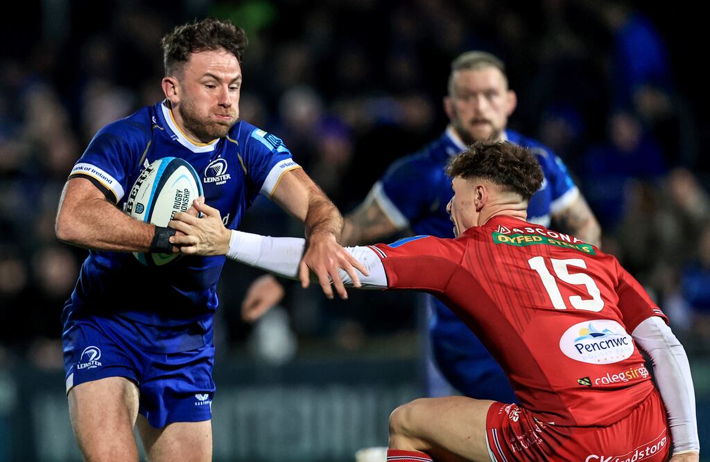 Leinster’s Hugo Keenan brushes off the attempted tackle of Scarlets' Tom Rogers during the BKT United Rugby Championship match at the RDS. Photograph: Dan Sheridan/Inpho