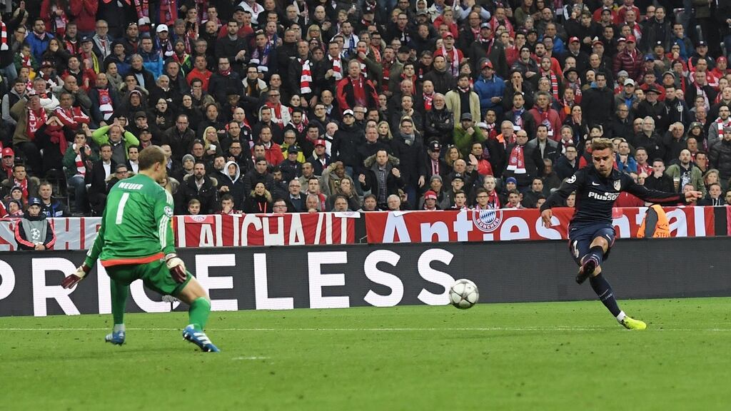 Antoine Griezmann of Atletico Madrid shoots past goalkeeper Bayern Munich goalkeeper Manuel Neuer to score during the Champions League semi-final second leg match at Allianz Arena. Photograph: Matthias Hangst/Bongarts/Getty Images