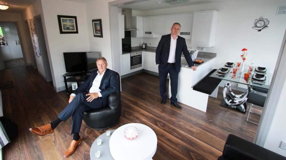Barry Alder and Tommy Forbes in a Modular Homes Ireland dwelling at the “cellular modular housing” exhibition. Photograph: Nick Bradshaw/The Irish Times