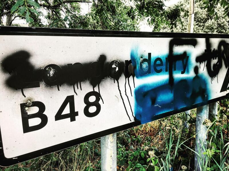 Ulster cycle: a defaced Londonderry sign