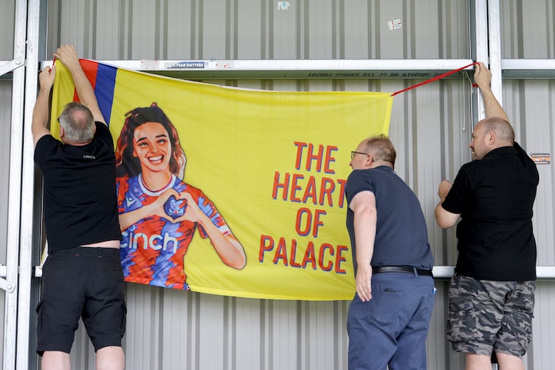 Crystal Palace fans hang a flag featuring Leigh Nicol prior to the Barclays FA Women's Championship match between Crystal Palace and Reading at VBS Community Stadium in Sutton, England. Photograph: Charlie Crowhurst - The FA/The FA via Getty Images