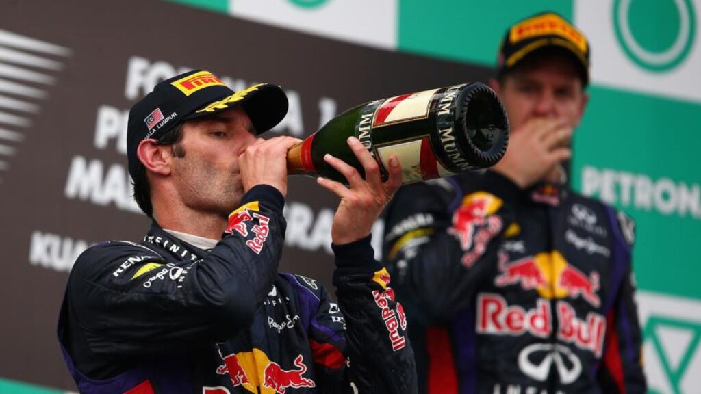 Mark Webber (left) of Australia and Infiniti Red Bull after finishing second to team-mate Sebastian Vettel of Germany (right) in Kuala Lumpur, Malaysia. Photograph: Clive Mason/Getty Images