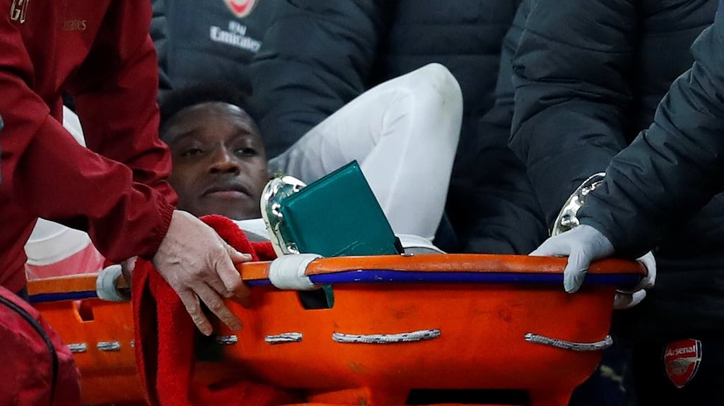 Danny Welbeck leaves the pitch on a stretcher after sustaining an injury. Photograph: Eddie Keogh/Reuters