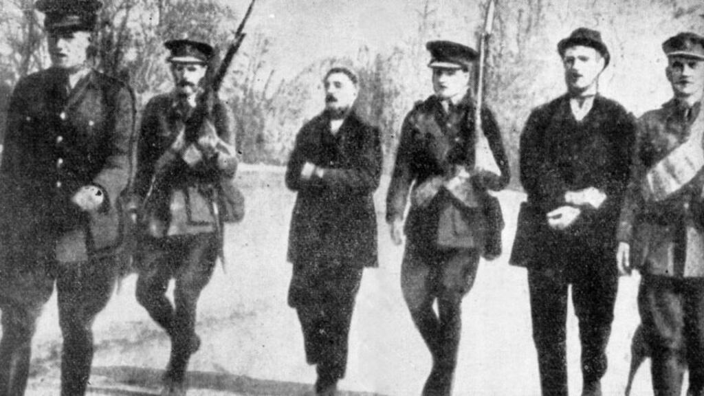 Thomas Kent (left) and William Kent being marched by British soldiers across Fermoy Bridge in May 1916