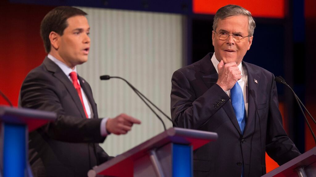 Republican presidential candidate Florida Senator Marco Rubio speaks as former Florida governor Jeb Bush looks on during the Republican presidential debate. The absence of Donald Trump meant the debate was more substantive, more about policy. Photograph: Jim Watson/AFP/Getty Images