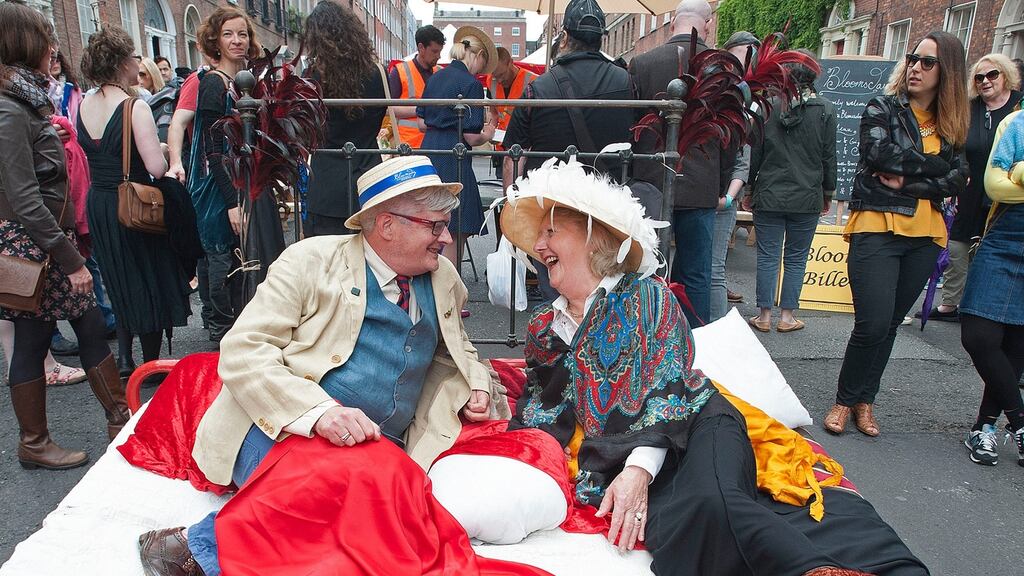 Michael Moran and Josephine O’Connell on “Molly Bloom’s bed” at the Bloomsday brunch and Street Party in Dublin. Photograph: Dave Meehan