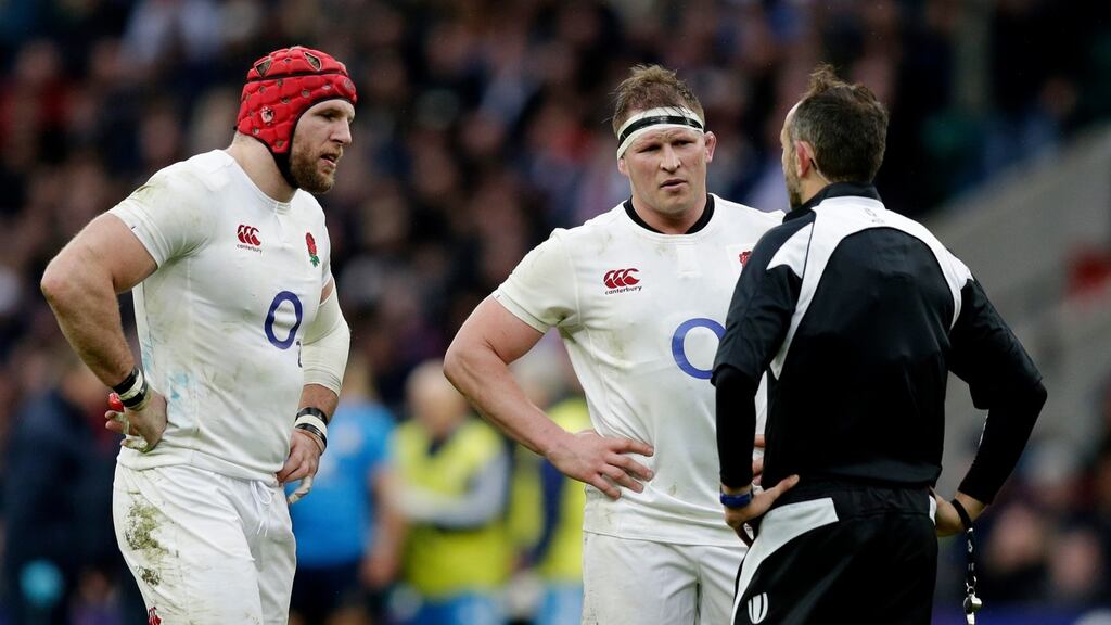 England’s Dylan Hartley speaks to referee Romain Poite during the game against Italy at Twickenham. Photograph: Henry Browne/Livepic/Reuters
