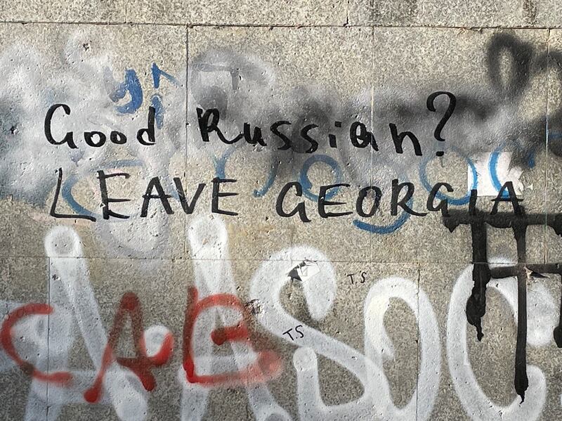 Graffiti in the Georgian capital, Tbilisi. Many buildings carry messages supporting Ukraine and Georgia and condemning Russia, which occupies parts of both smaller countries. Photograph: Daniel McLaughlin