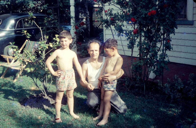 Boris Green stands in the backyard with sons Jon and Sam, 1950s. Photograph: Green family/Identity Films/BBC