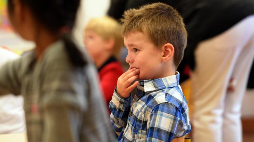 An emmotional Luke Delaney (4) , Lucan, on his first day at school, at Griffeen Valley Educate Together School, in Lucan. Photograph: Eric Luke