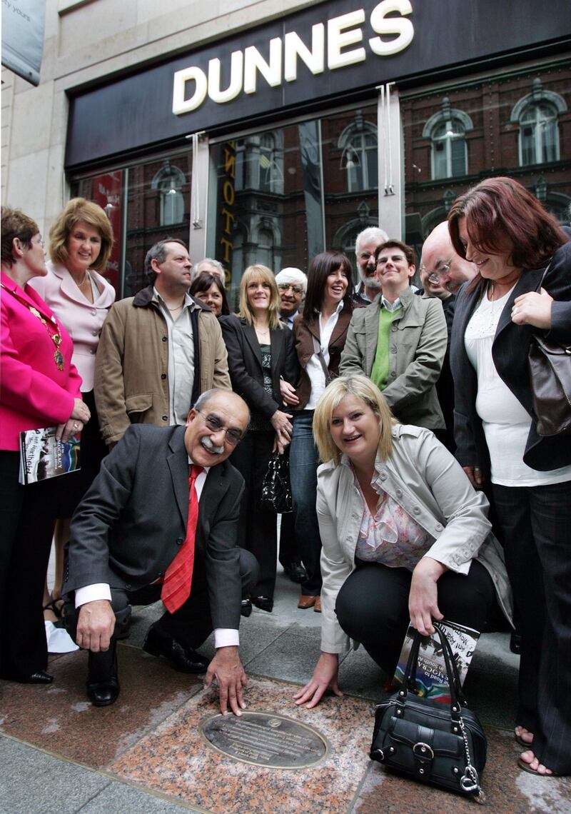 18/06/08 Photograph by Matt KavanaghThe former South African Minister for Education Professor Kader Asmal founder of the Irish Anti-Apartheid Movement at the unveiling of a plaque dedicated to Mary Manning kneeling, and Dunnes Stores staff who led a strike against apartheid in Henry Street, Dublin from 1984-1987. The plaque was originally presented to the group on behalf of the President of South Africa Thabo Mbeki on the 100th anniversary of International Women's Day.