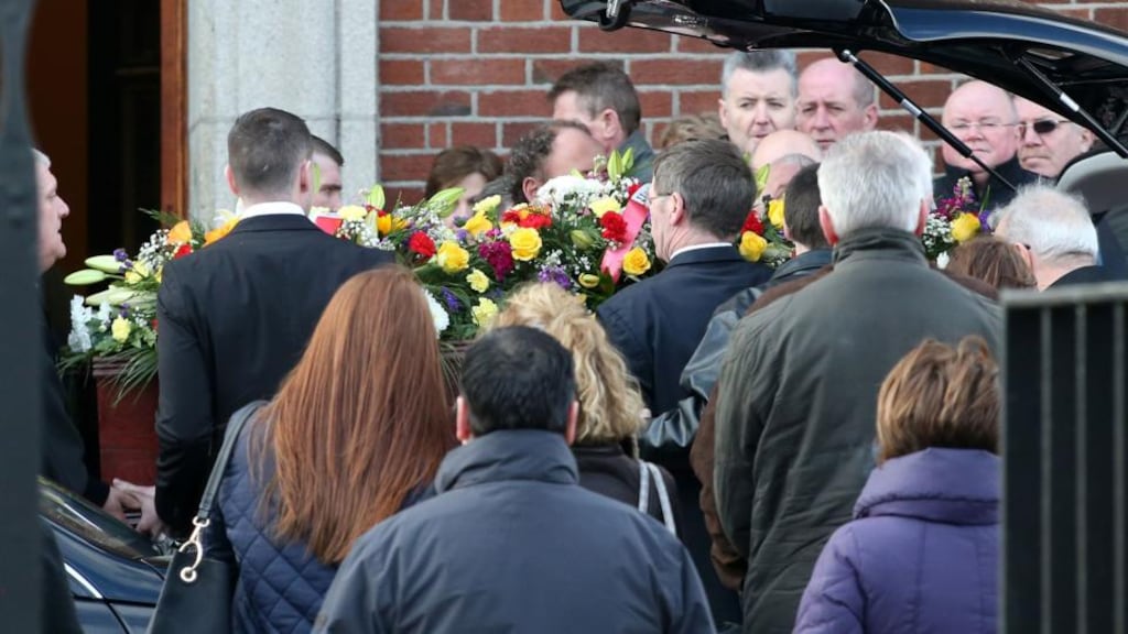 The remains of Edward Nugent, who was shot dead at the front door of his home, are taken from the Church of the Assumption of the Blessed Virgin Mary, Walkinstown, after his funeral Mass. Photograph: Colin Keegan/Collins Dublin