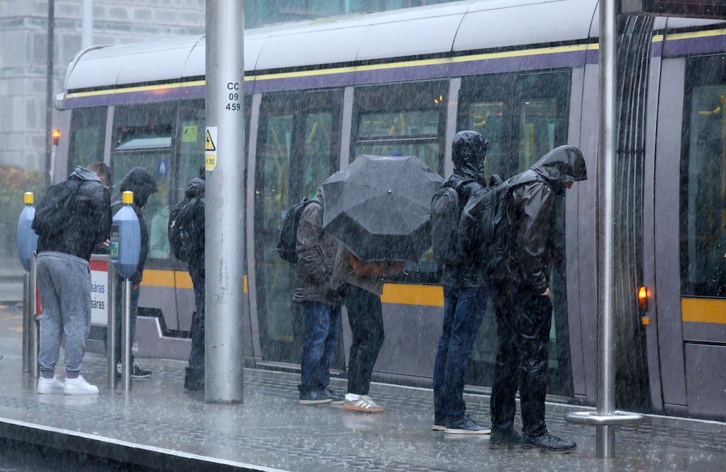 Commuters caught in torrential rain in Dublin. People seeking to work remotely are losing out when they take cases against their employers to the Workplace Relations Commission. Photograph: Colin Keegan/Collins