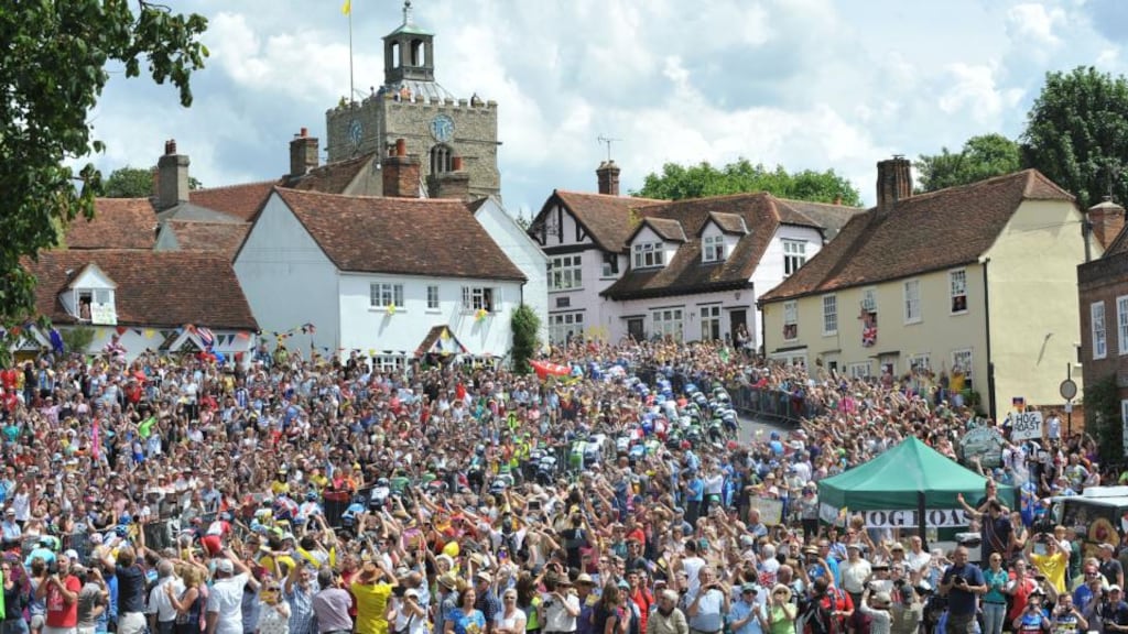 The peloton make their way up the short climb in the village of Finchingfield in north Essex during stage three of the Tour de France from Cambridge to London. Photograph: Nick Ansell/PA