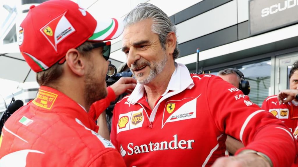 Ferrari Team Principal Maurizio Arrivabene congratulates pole sitter Sebastian Vettel. Photograph: Mark Thompson/Getty Images