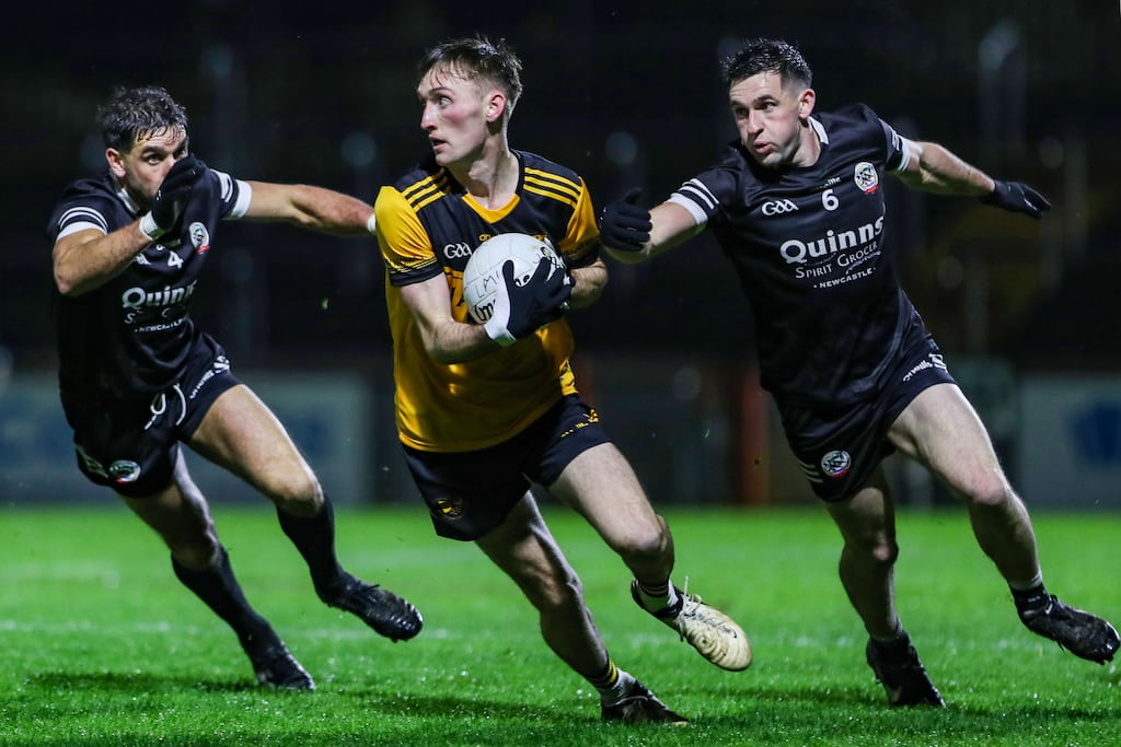 Loughmacrory's Cathaoir Gallagher and Kilcoo's Niall Branagan and Darryl Branagan. Photograph: Lorcan Doherty/Inpho