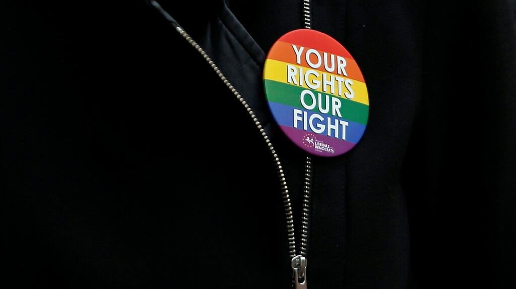 A woman wears a pin during a vigil in central Brussels, Belgium, in memory of the victims of the shootings at a gay nightclub in Orlando, Florida, US. File photograph: Francois Lenoir