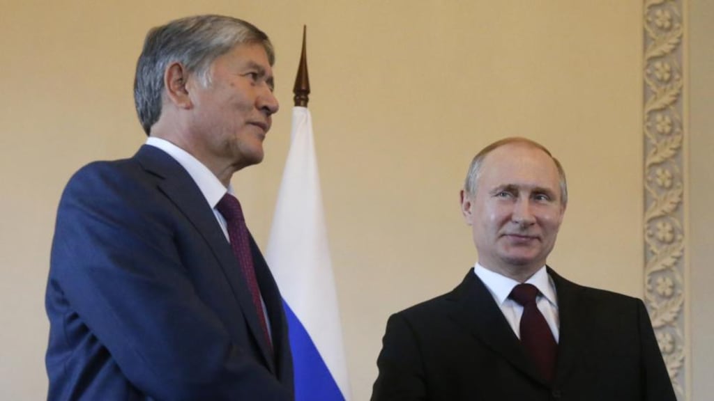 Russian president Vladimir Putin shakes hands with the president of Kyrgyzstan Almazbek Atambayev during a meeting in Saint Petersburg on Monday. Photograph: AFP/Getty Images
