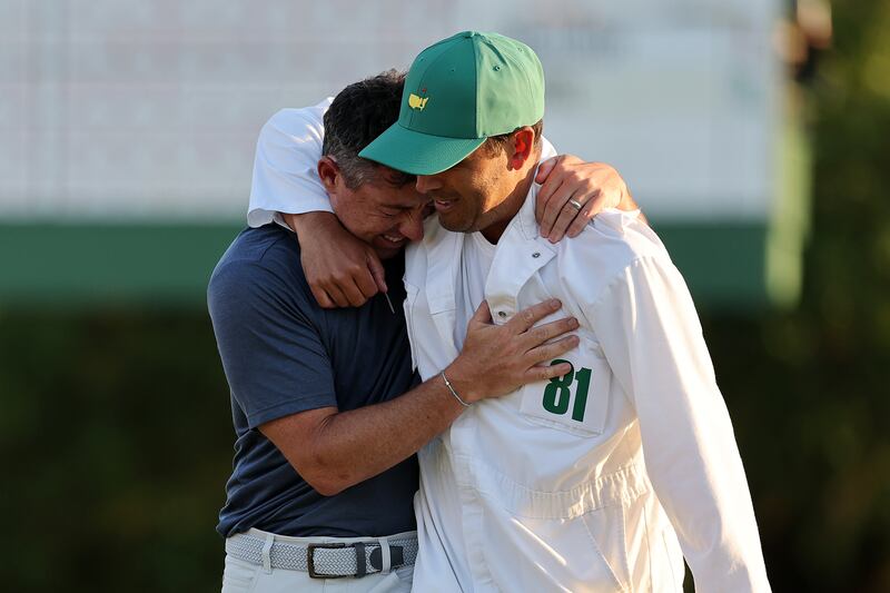 Rory McIlroy celebrates winning with caddie Harry Diamond. Photograph: Michael Reaves/Getty