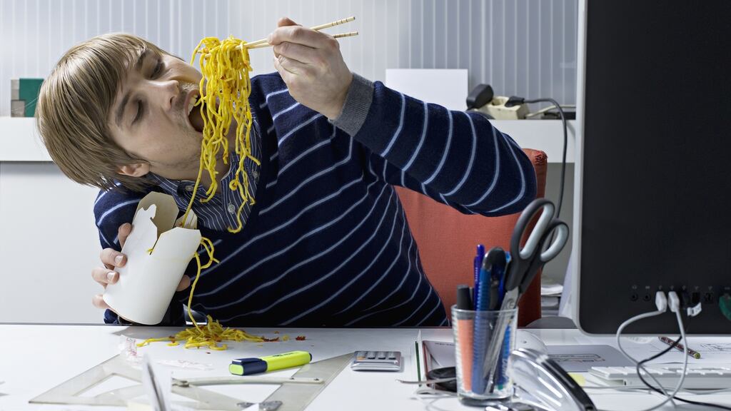 Eating lunch in front of your computer screen is a joyless exercise. Photograph: Getty