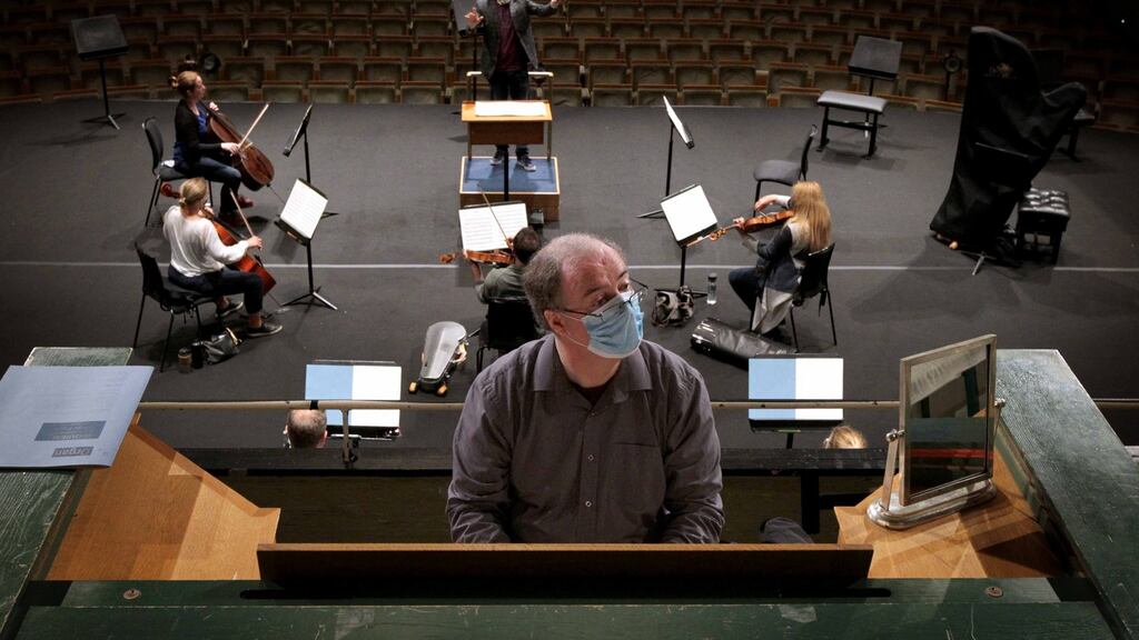 Organist Fergal Caulfield rehearsing on stage at NCH for a special performance of Faure’s Requiem dedicated to victims of Covid-19. Photograph: Mark Stedman