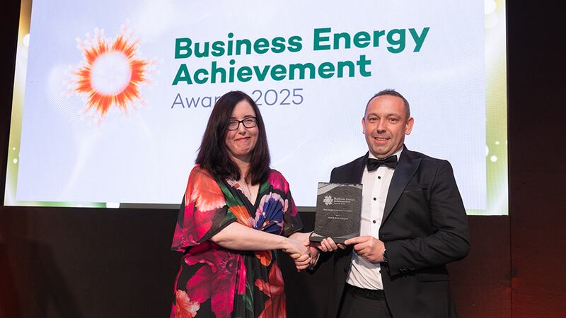 Aideen O'Hora, awards judge, presents the best energy achievement in utilities to Martin Mulholland, Activ8 Solar Energies