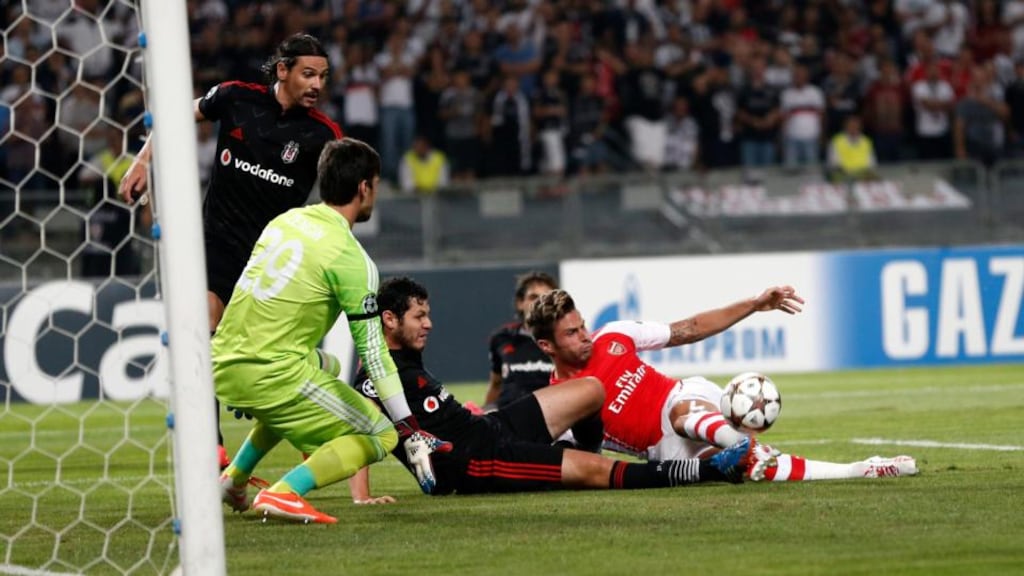 Arsenal’s Olivier Giroud tries to get a shot away while under pressure from the Besiktas defence during the Champions League play-off in Istanbul, Turkey. Photograph: Tolga Bozoglu/EPA