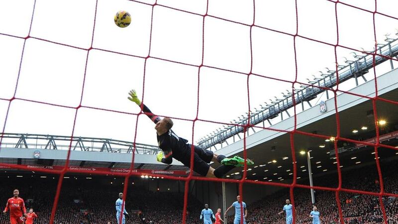 Manchester City’s Joe Hart can’t stop Liverpool’s Jordan Henderson from scoring the opening goal. Photograph: EPA
