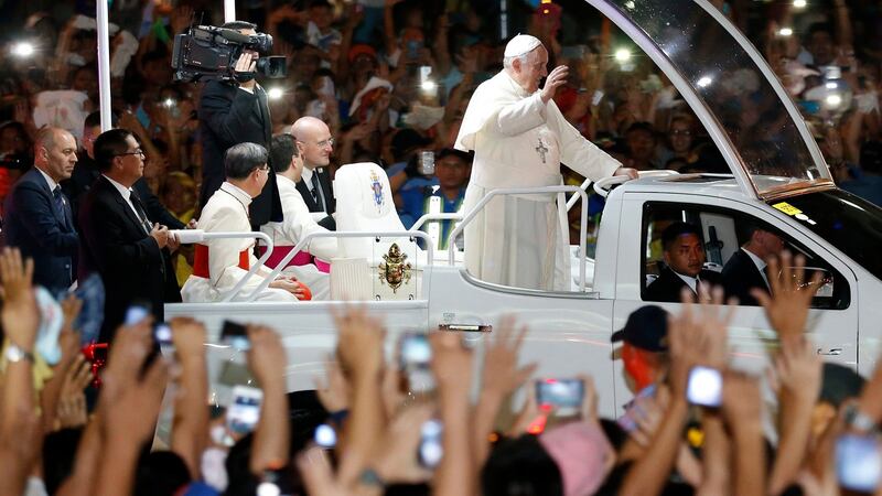 Pope Francis on a Popemobile waves to Filipino well wishers in 2015. Photograph: Francis R Malasig/EPA