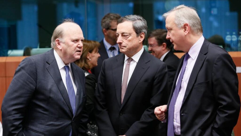 Finance Minister Michael Noonan,  Mario Draghi and Olli Rehn. Photograph: Olivier Hoslet/EPA